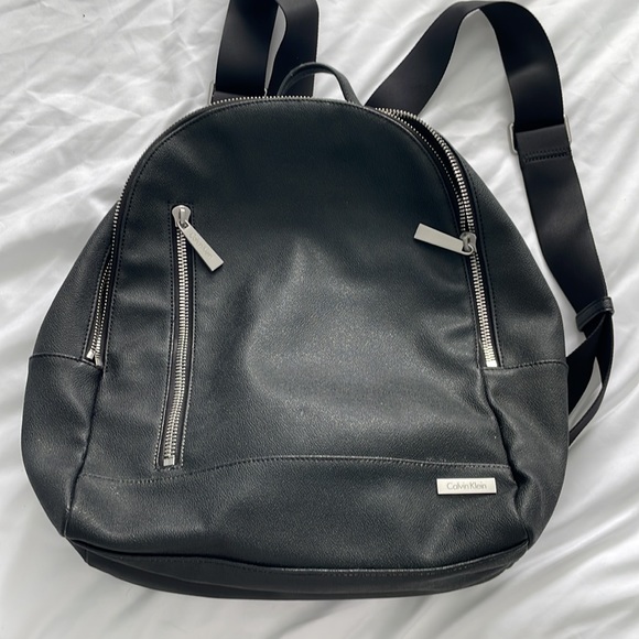 calvin klein leather backpacks Estelle Novelty-Backpack, Caramel minimalist form with an embossed logo at the front Calvin Klein Sandi Slim Backpack